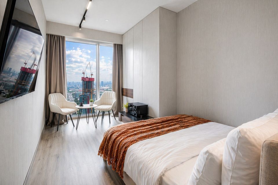 Панорамная студия в Москва-Сити с видом на башни и город