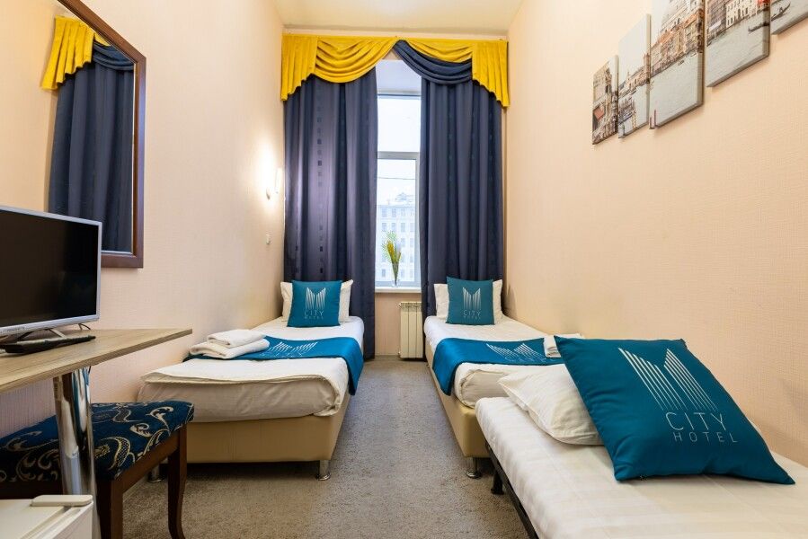 Трехместные апартаменты с раздельными кроватями в центре