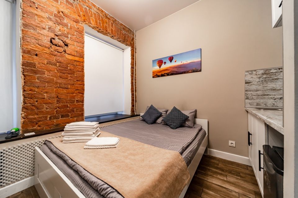 Двуxуpовневая студия в центре города