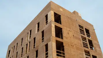 В России начнут строить деревянные многоэтажки через два года